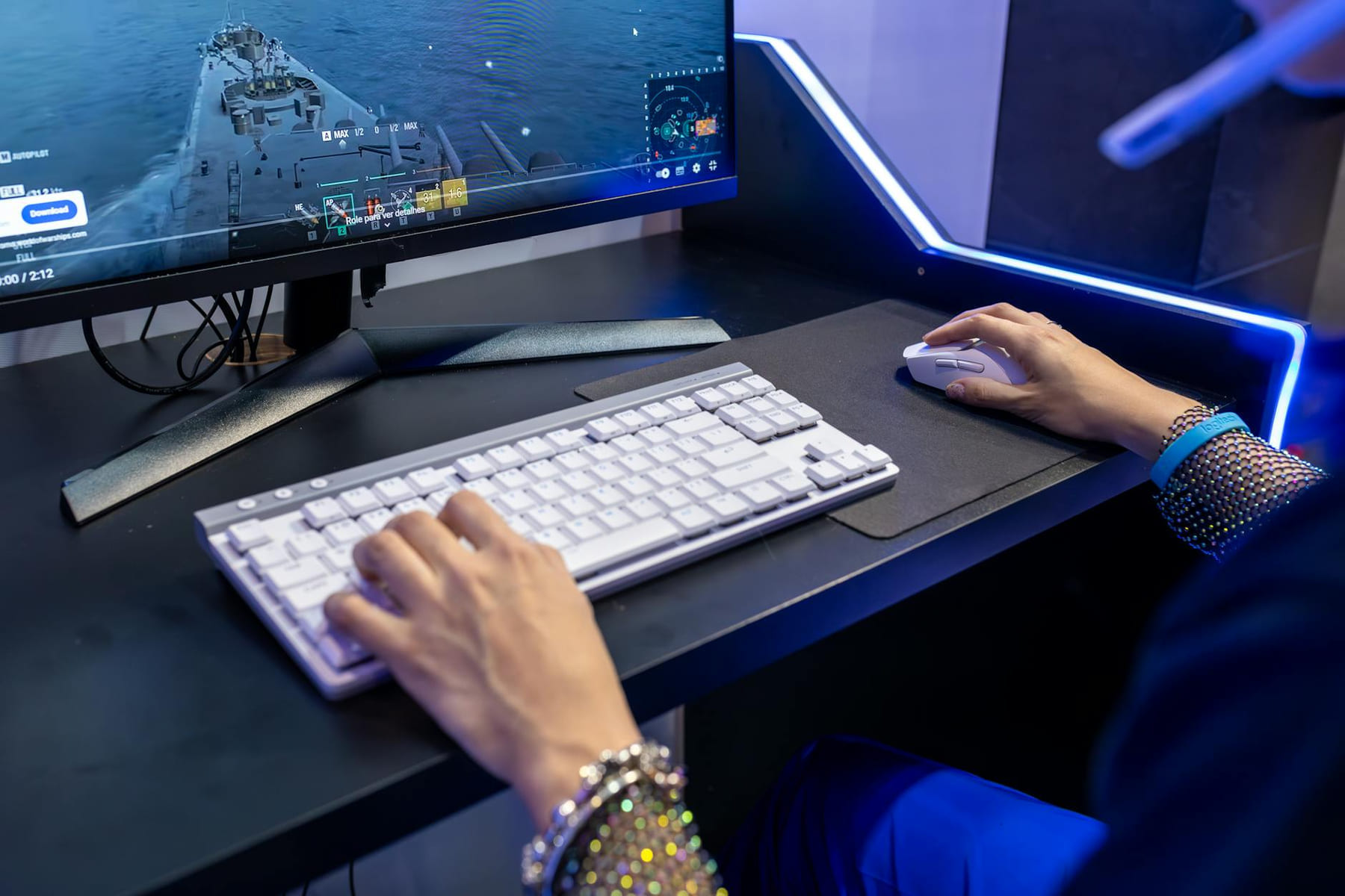 Close-up of a person gaming on a PC with a colorful setup and gaming accessories. on Frame Rate Vault