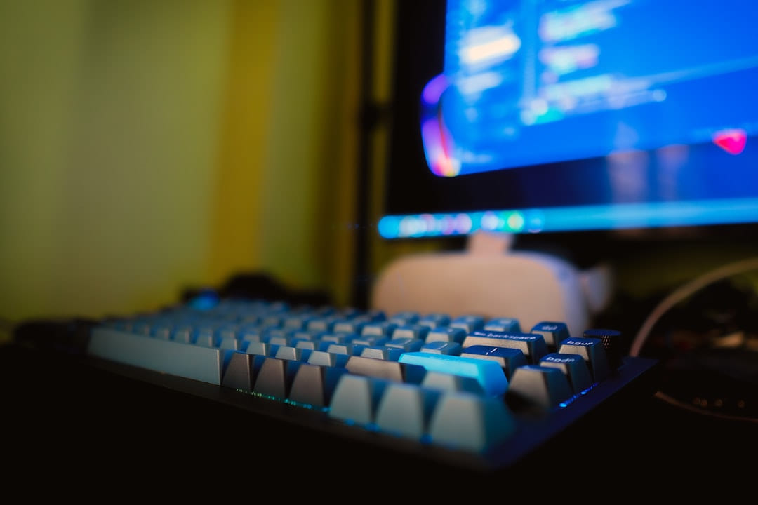 a computer keyboard sitting in front of a monitor on Frame Rate Vault