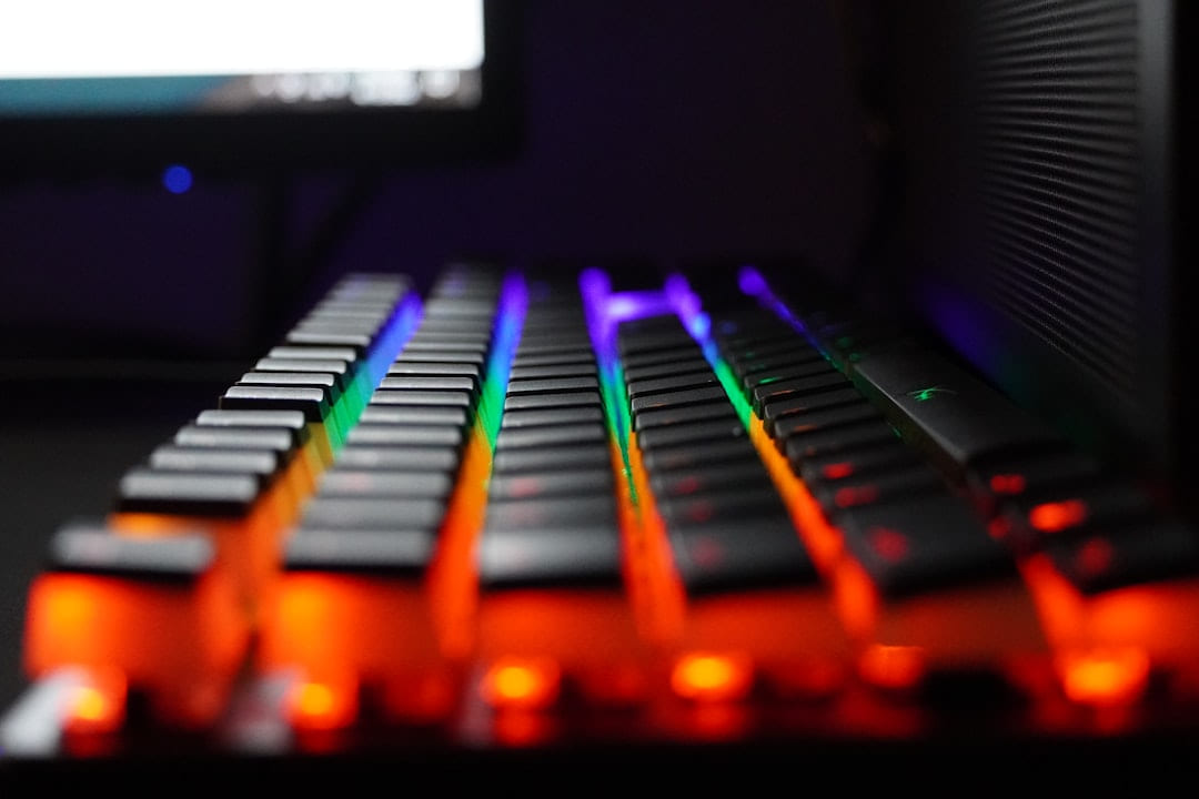 a close up of a keyboard with a monitor in the background on Frame Rate Vault