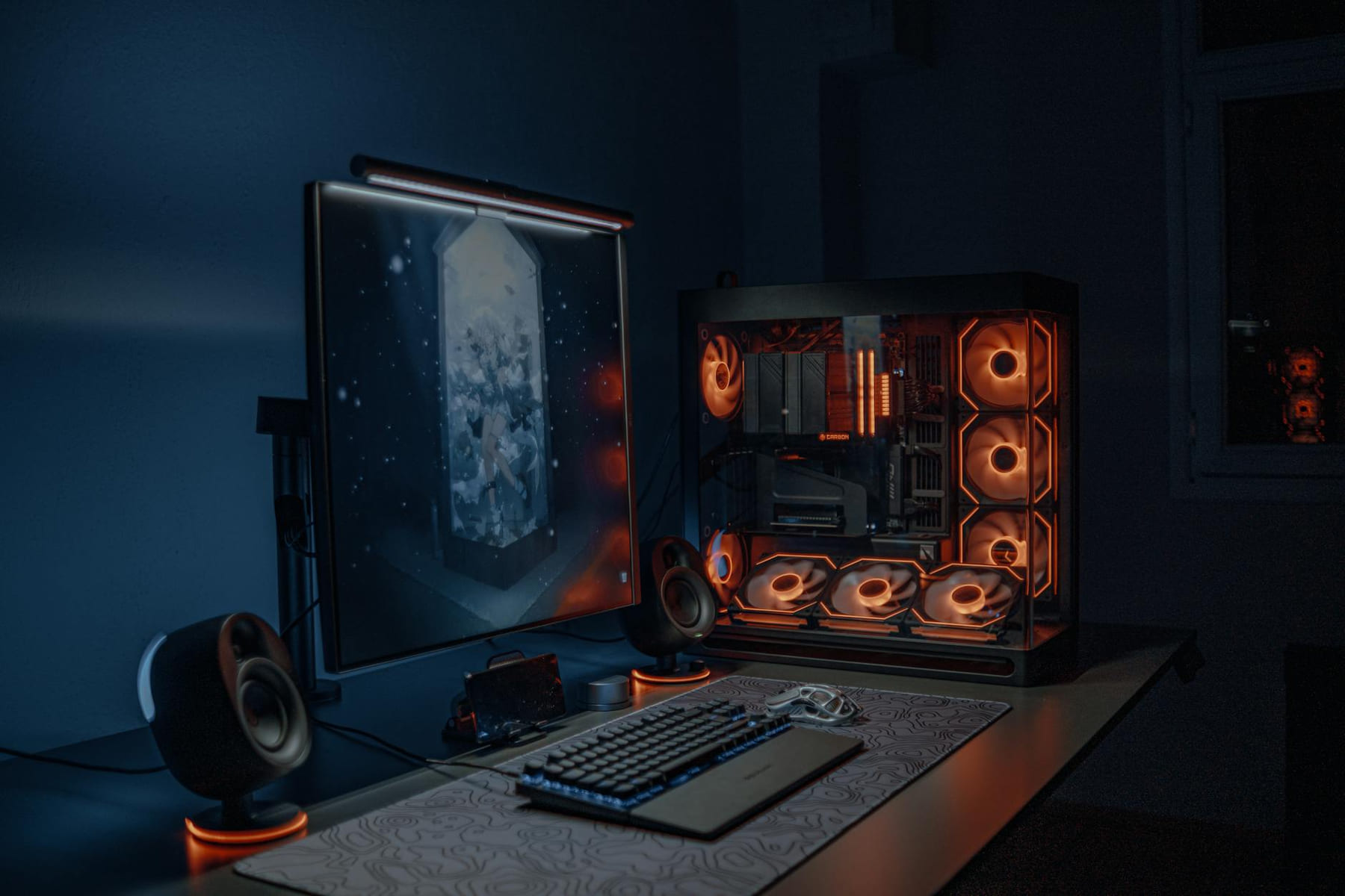 A sleek gaming PC setup with LED lights, monitor, and keyboard in a dimly lit room. on Frame Rate Vault