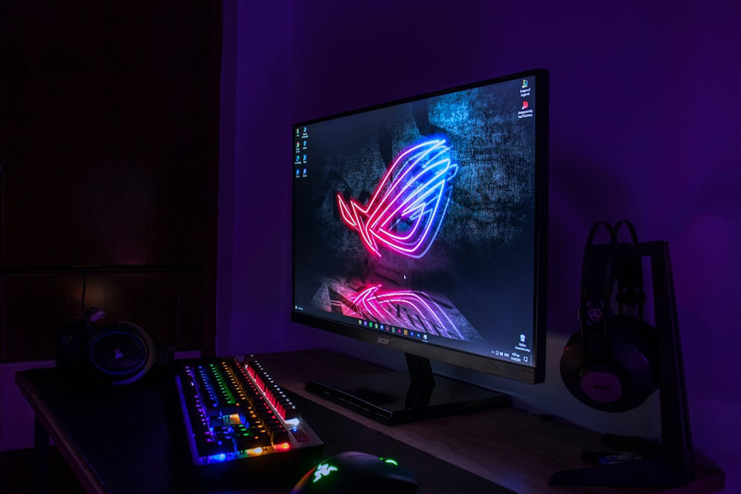 a computer monitor and keyboard lit up in the dark on Frame Rate Vault
