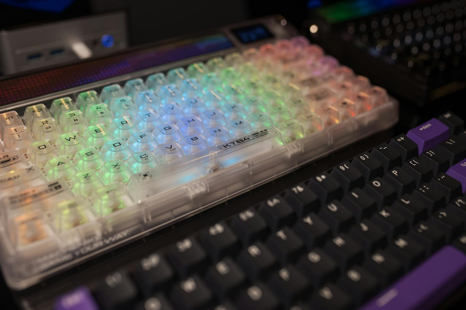 Vibrant RGB mechanical keyboards with transparent and black keycaps, perfect for gaming setups. on Frame Rate Vault