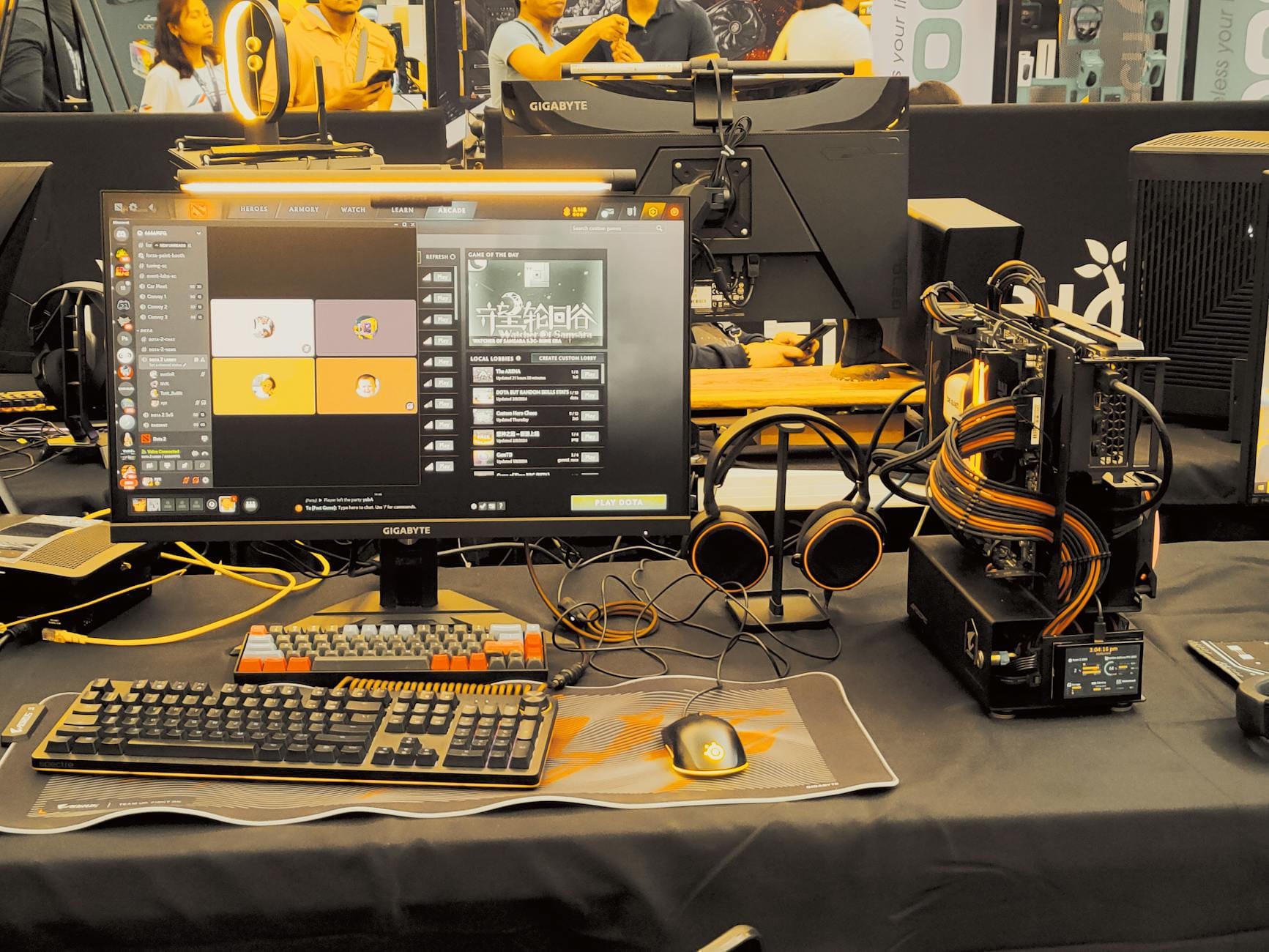 Modern gaming gear setup on display at a tech expo. on Frame Rate Vault